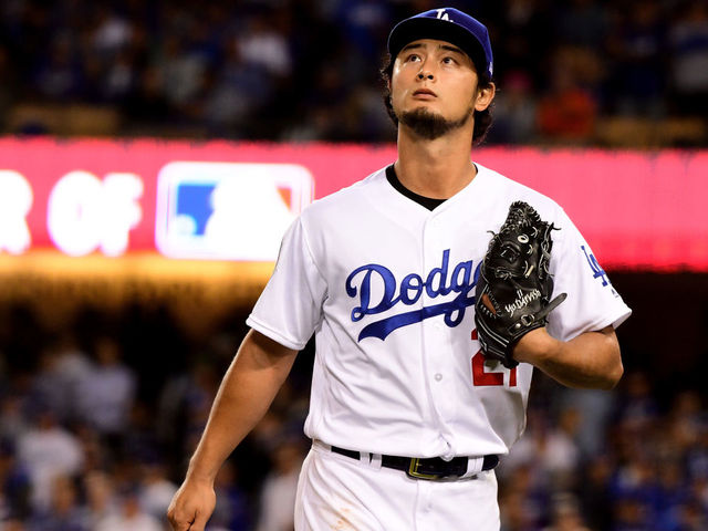 LOS ANGELES, CA - NOVEMBER 01: Yu Darvish #21 of the Los Angeles Dodgers walks to the dugout after being relieved during the second inning against the Houston Astros in game seven of the 2017 World Series at Dodger Stadium on November 1, 2017 in Los Angeles, California.
