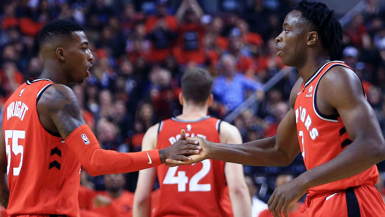 TORONTO, ON - OCTOBER 19: OG Anunoby #3 of the Toronto Raptors celebrates his first 2 points with Delon Wright #55 during the first half of an NBA game against the Chicago Bulls at Air Canada Centre on October 19, 2017 in Toronto, Canada.