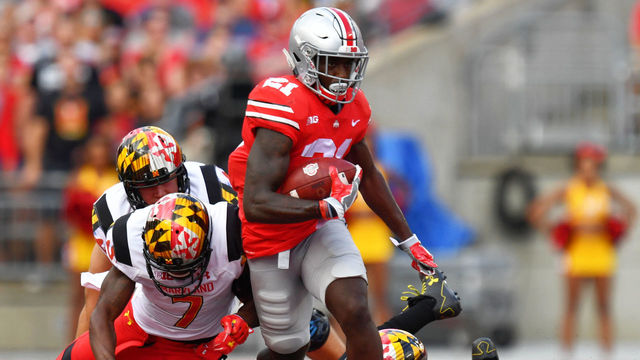 COLUMBUS, OH - OCTOBER 7: Parris Campbell #21 of the Ohio State Buckeyes breaks free from JC Jackson #7 of the Maryland Terrapins in the first quarter to pick up yardage at Ohio Stadium on October 7, 2017 in Columbus, Ohio.