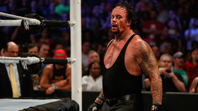NEW YORK, NY - AUGUST 23: The Undertaker recovers during his fight against Brock Lesner at the WWE SummerSlam 2015 at Barclays Center of Brooklyn on August 23, 2015 in New York City.