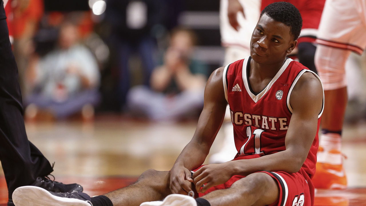 CHAMPAIGN, IL - NOVEMBER 29: Markell Johnson #11 of the North Carolina State Wolfpack reacts after fouling out against the Illinois Fighting Illini at State Farm Center on November 29, 2016 in Champaign, Illinois. Illinois defeated North Carolina State 88-74.