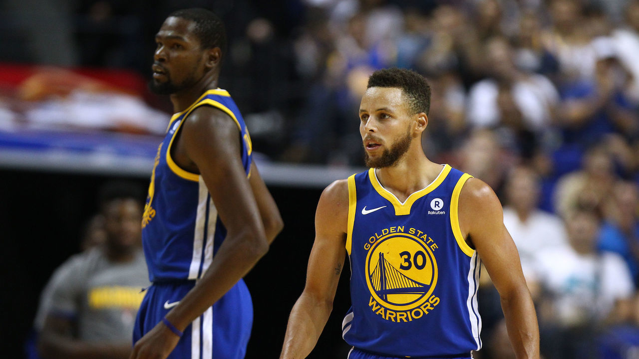 SHANGHAI, CHINA - OCTOBER 08: Stephen Curry #30 and Kevin Durant #35 of the Golden State Warriors look on during the game between the Minnesota Timberwolves and the Golden State Warriors as part of 2017 NBA Global Games China at Mercedes-Benz Arena on October 8, 2017 in Shanghai, China.