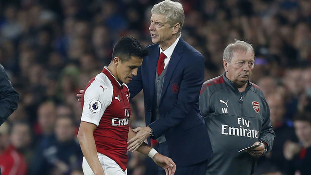 Arsenal's Chilean striker Alexis Sanchez passes Arsenal's French manager Arsene Wenger as he substituted off of the pitch during the English Premier League football match between Arsenal and West Bromwich Albion at the Emirates Stadium in London on September 25, 2017. / AFP PHOTO / Ian KINGTON /