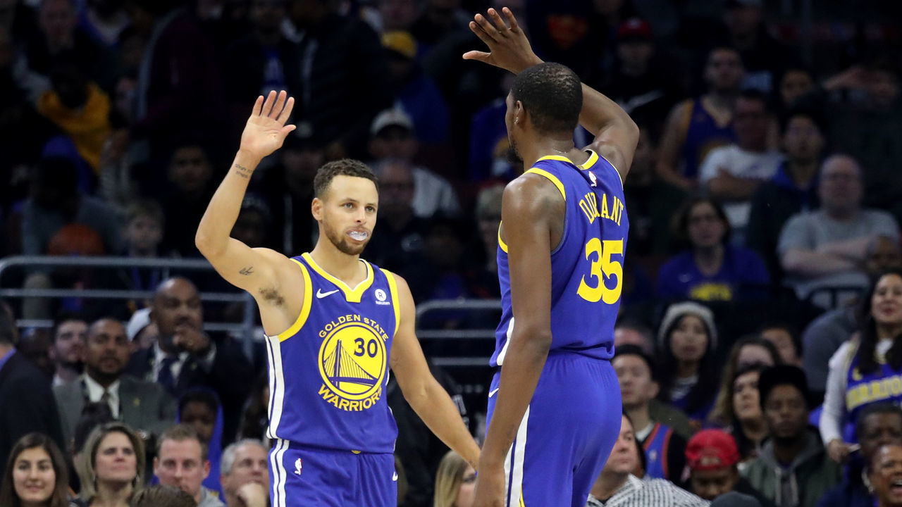 PHILADELPHIA, PA - NOVEMBER 18: Stephen Curry #30 and Kevin Durant #35 of the Golden State Warriors celebrate during the end of the Warriors 124-116 win over the Philadelphia 76ers at Wells Fargo Center on November 18, 2017 in Philadelphia,Pennsylvania.