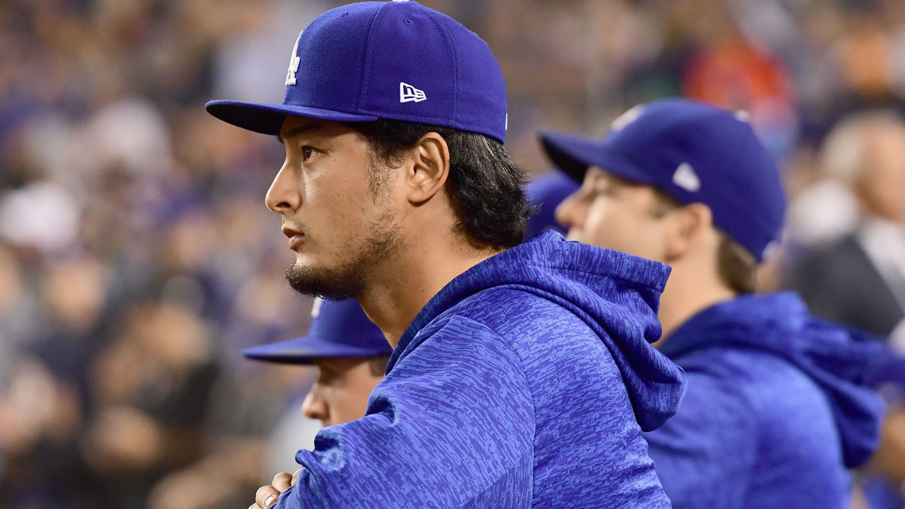 LOS ANGELES, CA - OCTOBER 31: Yu Darvish #21 of the Los Angeles Dodgers looks on from the dugout in game six of the 2017 World Series against the Houston Astros at Dodger Stadium on October 31, 2017 in Los Angeles, California.