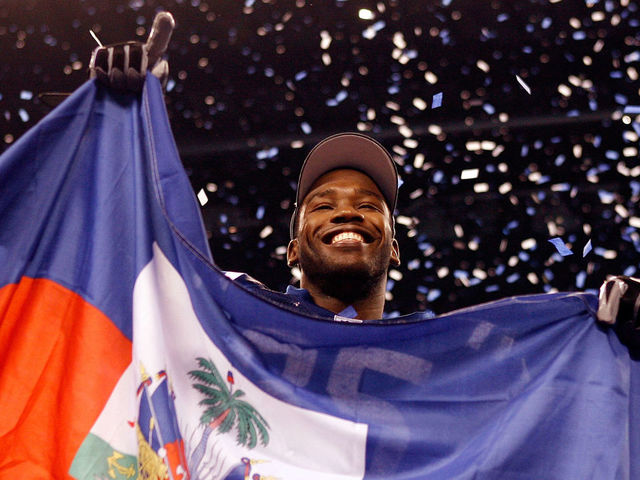 INDIANAPOLIS - JANUARY 24: Wide receiver Pierre Garcon #85 of the Indianapolis Colts celebrates with the Haitian flag after the Colts defeated the New York Jets 30-17 in the AFC Championship Game at Lucas Oil Stadium on January 24, 2010 in Indianapolis, Indiana.