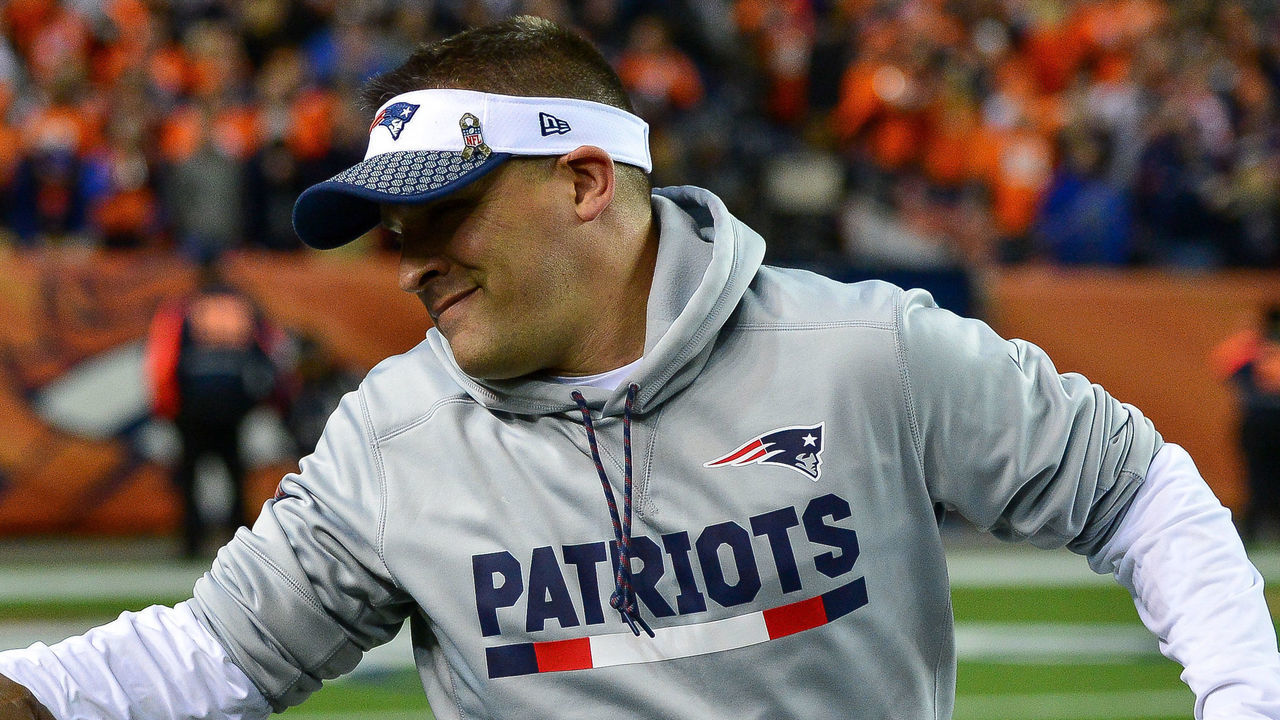 DENVER, CO - NOVEMBER 12: Offensive coordinator Josh McDaniels shakes hands with a member of the armed forces on the field before a game between the Denver Broncos and the New England Patriots at Sports Authority Field at Mile High on November 12, 2017 in Denver, Colorado.