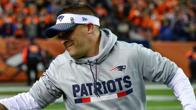 DENVER, CO - NOVEMBER 12: Offensive coordinator Josh McDaniels shakes hands with a member of the armed forces on the field before a game between the Denver Broncos and the New England Patriots at Sports Authority Field at Mile High on November 12, 2017 in Denver, Colorado.