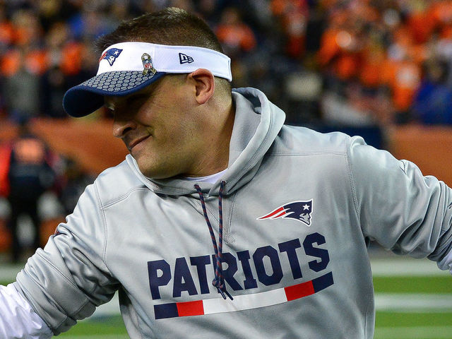 DENVER, CO - NOVEMBER 12: Offensive coordinator Josh McDaniels shakes hands with a member of the armed forces on the field before a game between the Denver Broncos and the New England Patriots at Sports Authority Field at Mile High on November 12, 2017 in Denver, Colorado.