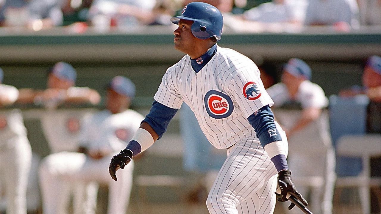 MESA, : Chicago Cubs slugger Sammy Sosa watches his ball go deep into center field for an out against the Seattle Mariners during Cactus League play 05 March in Mesa, Arizona. Sosa hit 66 home runs in the 1998 baseball season behind St. Louis Cardinal Mark McGwire, who hit 70. AFP PHOTO/John G. MABANGLO