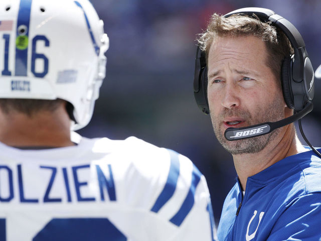 INDIANAPOLIS, IN - AUGUST 13: Indianapolis Colts quarterbacks coach Brian Schottenheimer talks to Scott Tolzien #16 during a preseason game against the Detroit Lions at Lucas Oil Stadium on August 13, 2017 in Indianapolis, Indiana.
