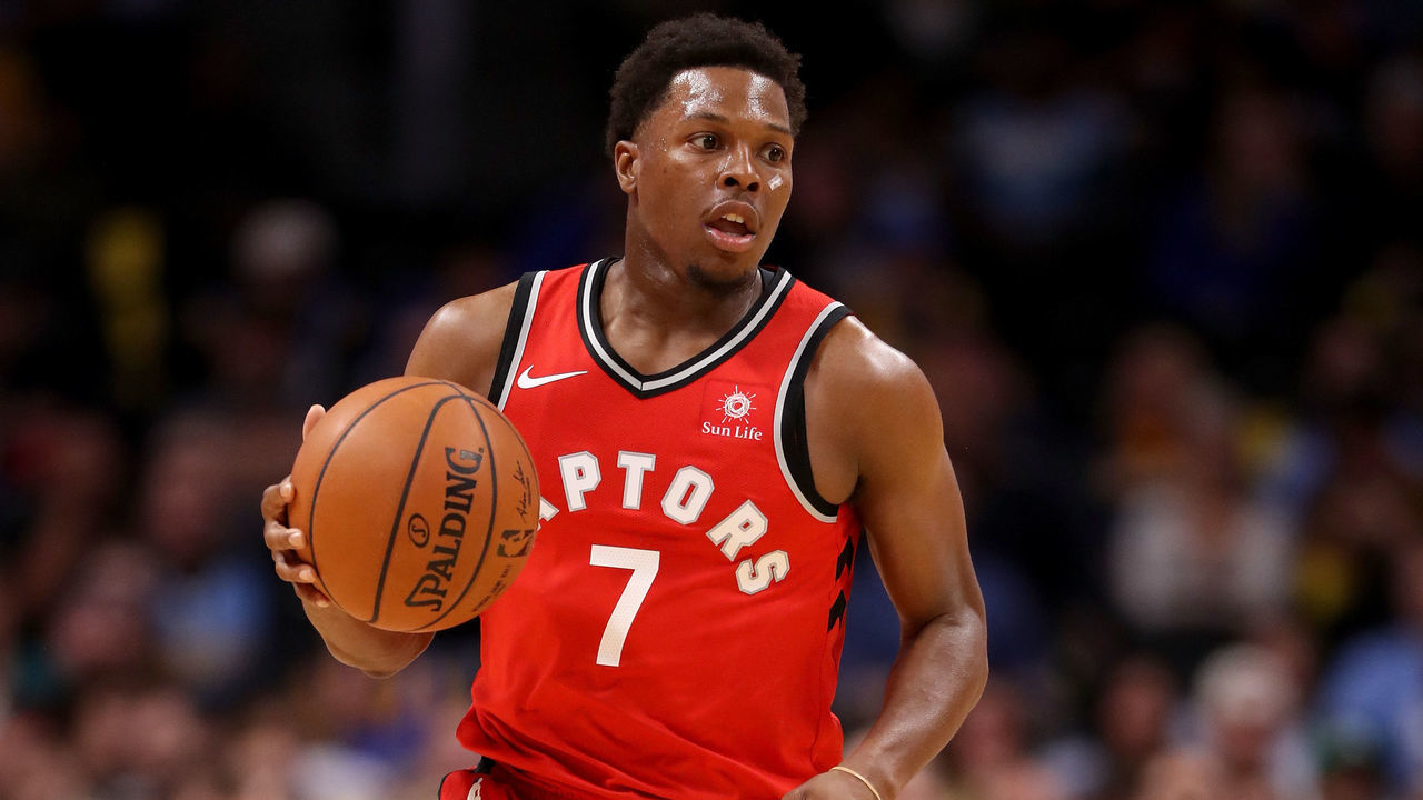 DENVER, CO - NOVEMBER 01: Kyle Lowry #7 of the Toronto Raptors brings the ball down the court against the Denver Nuggets at the Pepsi Center on November 1, 2017 in Denver, Colorado.