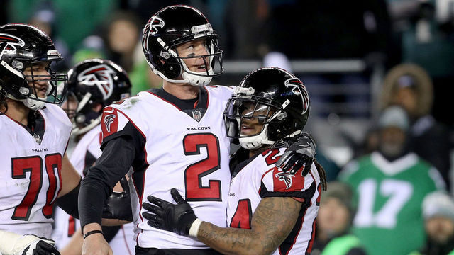 PHILADELPHIA, PA - JANUARY 13: Running back Devonta Freeman #24 of the Atlanta Falcons celebrates with Matt Ryan #2 after his touchdown against the Philadelphia Eagles during the second quarter in the NFC Divisional Playoff game at Lincoln Financial Field on January 13, 2018 in Philadelphia, Pennsylvania.