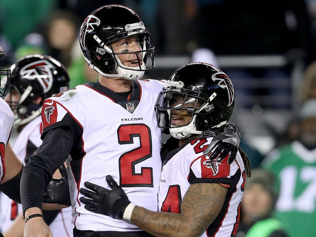 PHILADELPHIA, PA - JANUARY 13: Running back Devonta Freeman #24 of the Atlanta Falcons celebrates with Matt Ryan #2 after his touchdown against the Philadelphia Eagles during the second quarter in the NFC Divisional Playoff game at Lincoln Financial Field on January 13, 2018 in Philadelphia, Pennsylvania.