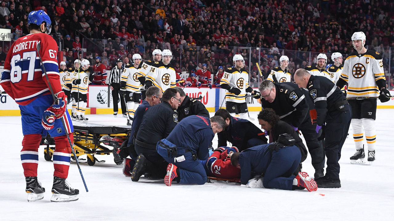 MONTREAL, QC - JANUARY 13: Phillip Danault #24 of the Montreal Canadiens is assisted off the ice after an injury In the second period of NHL game against the Boston Bruins at the Bell Centre on January 13, 2018 in Montreal, Quebec, Canada.