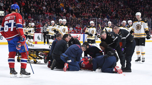 MONTREAL, QC - JANUARY 13: Phillip Danault #24 of the Montreal Canadiens is assisted off the ice after an injury In the second period of NHL game against the Boston Bruins at the Bell Centre on January 13, 2018 in Montreal, Quebec, Canada.