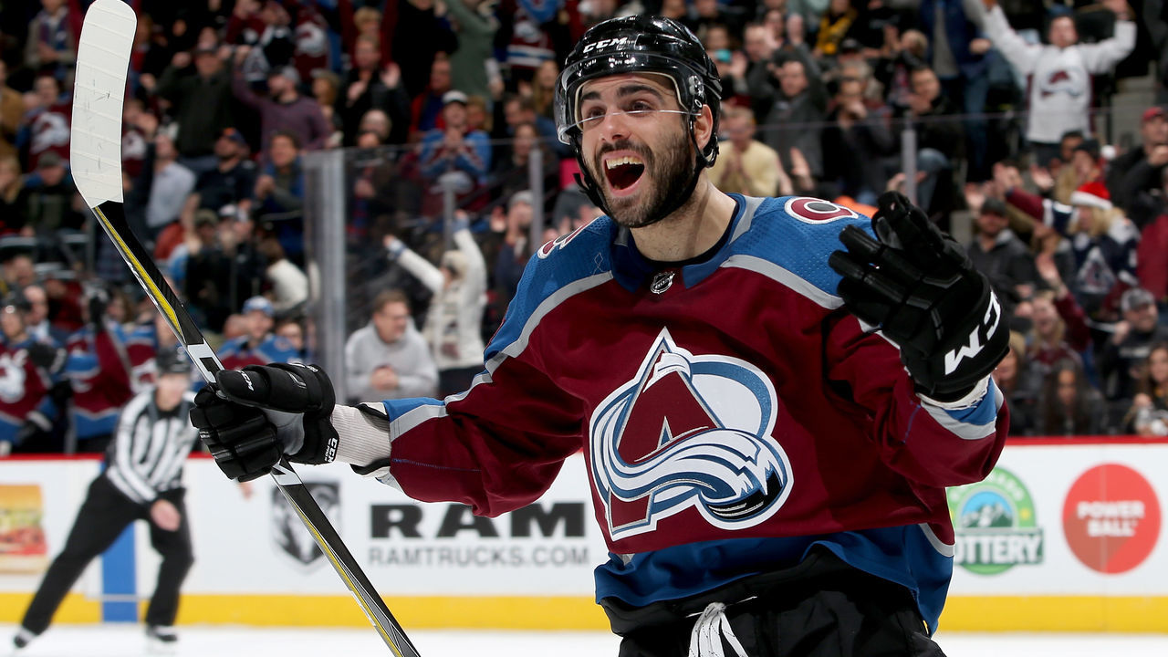 DENVER, CO - DECEMBER 18: Mark Barberio #44 of the Colorado Avalanche celebrates a J.T. Compher goal against the Pittsburgh Penguins at the Pepsi Center on December 18, 2017 in Denver, Colorado.