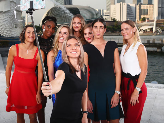 SINGAPORE - OCTOBER 20: Caroline Garcia (FRA), Venus Williams (USA), Elina Svitolina (UKR), Simona Halep (ROU), Garbine Muguruza (ESP), Karolina Pliskova (CZE), Caroline Wozniacki (DEN) and Jelena Ostapenko (LAT), the 2017 BNP Paribas WTA Finals Singapore presented by SC Global singles field pose for a selfie at Merlion Park overlooking Marina Bay on October 20, 2017 in Singapore.