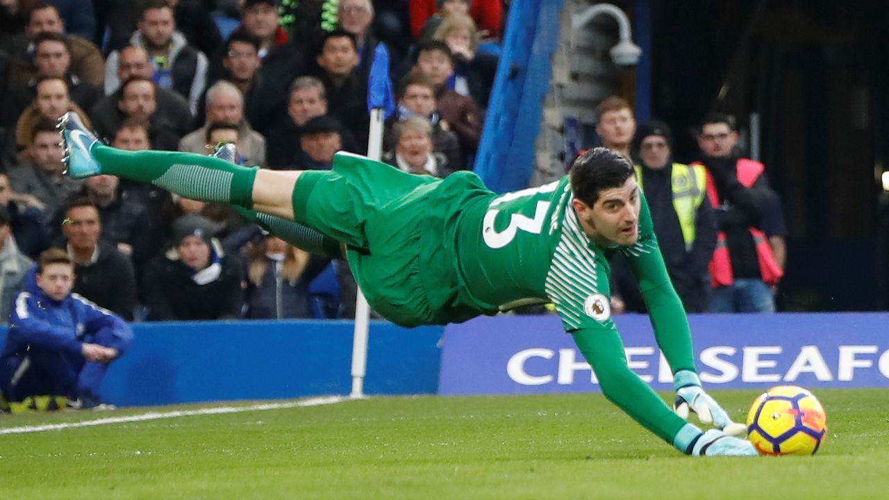 Chelsea's Belgian goalkeeper Thibaut Courtois makes a save during the English Premier League football match between Chelsea and Leicester City at Stamford Bridge in London on January 13, 2018. / AFP PHOTO / Tolga AKMEN /