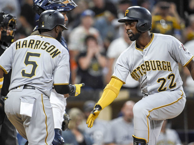 SAN DIEGO, CA - JULY 28: Andrew McCutchen #22 of the Pittsburgh Pirates, right, celebrates with Josh Harrison #5 after he hit a two-run home run during the third inning of a baseball game against the San Diego Padres at PETCO Park on July 28, 2017 in San Diego, California.