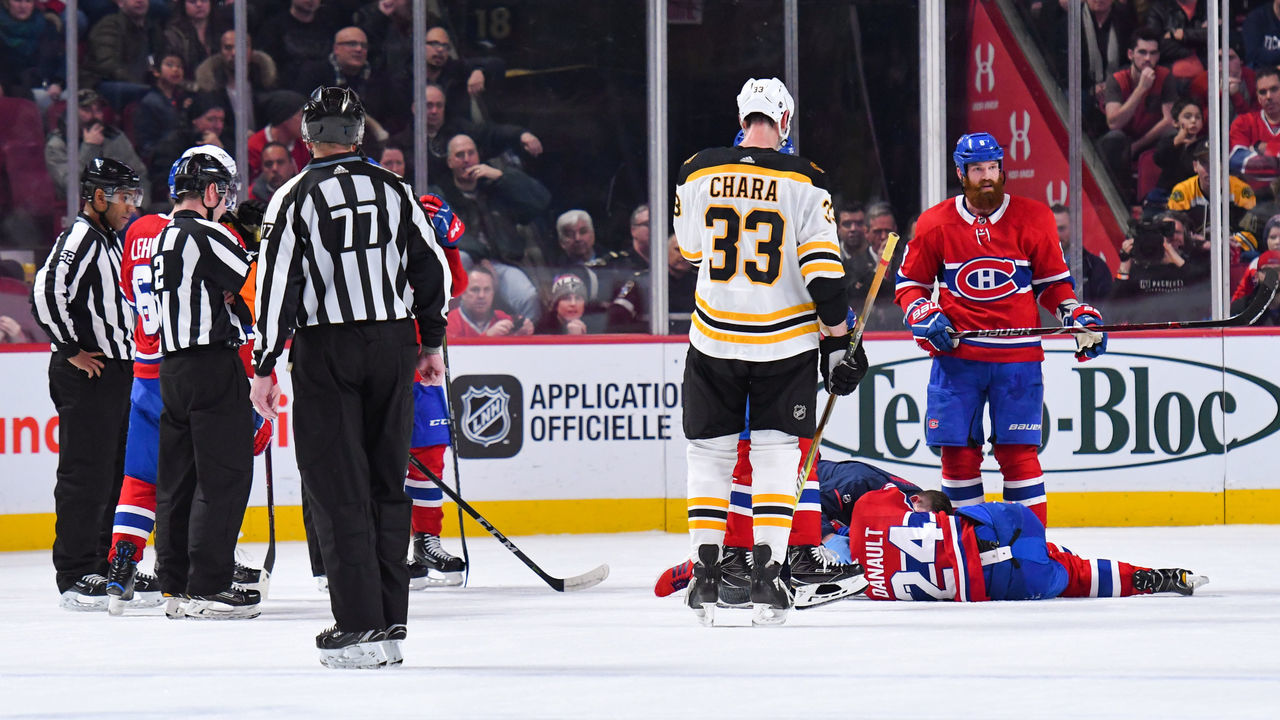 MONTREAL, QC - JANUARY 13: Montreal Canadiens Center Phillip Danault (24) lays on the ice for long minutes after being hit on the head by a shot from Boston Bruins Defenceman Zdeno Chara (33) during the Boston Bruins versus the Montreal Canadiens game on January 13, 2018, at Bell Centre in Montreal, QC