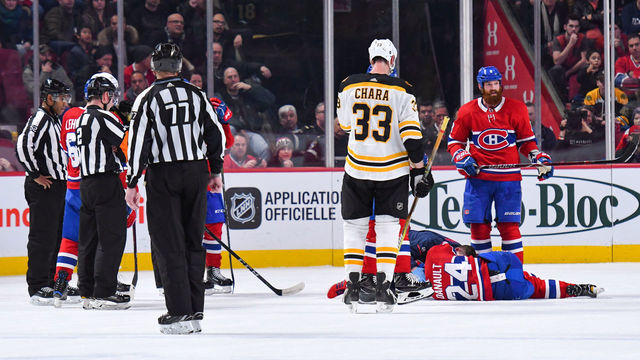 MONTREAL, QC - JANUARY 13: Montreal Canadiens Center Phillip Danault (24) lays on the ice for long minutes after being hit on the head by a shot from Boston Bruins Defenceman Zdeno Chara (33) during the Boston Bruins versus the Montreal Canadiens game on January 13, 2018, at Bell Centre in Montreal, QC