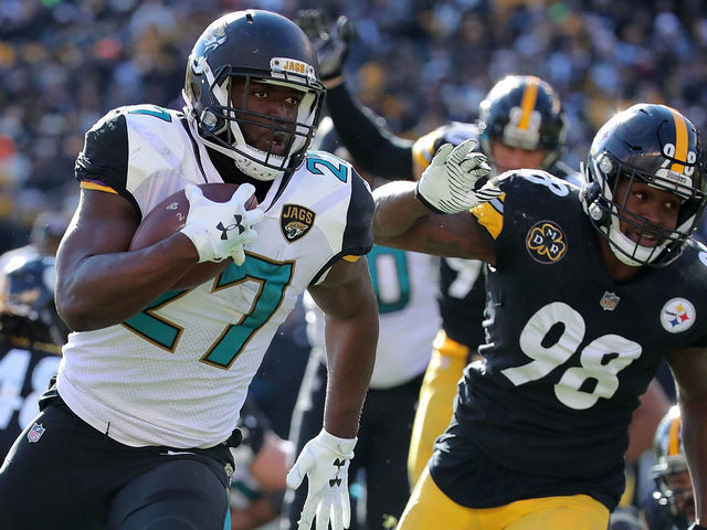 PITTSBURGH, PA - JANUARY 14: Leonard Fournette #27 of the Jacksonville Jaguars rushes for an 18 yard touchdown in the first quarter during the AFC Divisional Playoff game against the Pittsburgh Steelers at Heinz Field on January 14, 2018 in Pittsburgh, Pennsylvania.