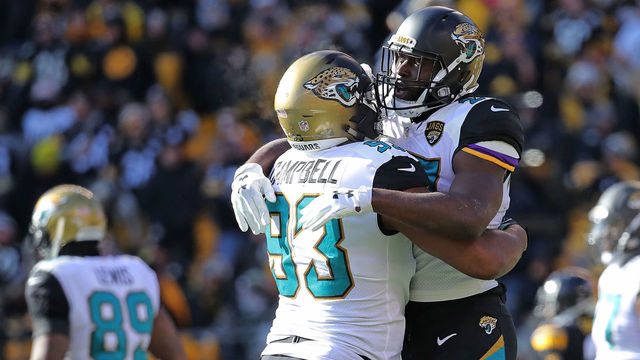 PITTSBURGH, PA - JANUARY 14: Leonard Fournette #27 of the Jacksonville Jaguars celebrates with Calais Campbell #93 after rushing for a 1 yard touchdown in the first quarter during the AFC Divisional Playoff game against the Pittsburgh Steelers at Heinz Field on January 14, 2018 in Pittsburgh, Pennsylvania.