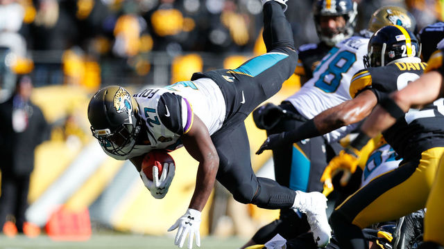 PITTSBURGH, PA - JANUARY 14: Leonard Fournette #27 of the Jacksonville Jaguars dives into the end zone for a touchdown against the Pittsburgh Steelers during the first half of the AFC Divisional Playoff game at Heinz Field on January 14, 2018 in Pittsburgh, Pennsylvania.