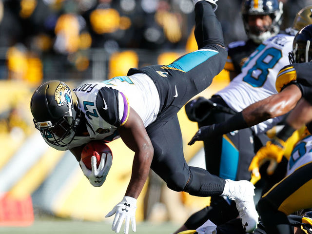 PITTSBURGH, PA - JANUARY 14: Leonard Fournette #27 of the Jacksonville Jaguars dives into the end zone for a touchdown against the Pittsburgh Steelers during the first half of the AFC Divisional Playoff game at Heinz Field on January 14, 2018 in Pittsburgh, Pennsylvania.