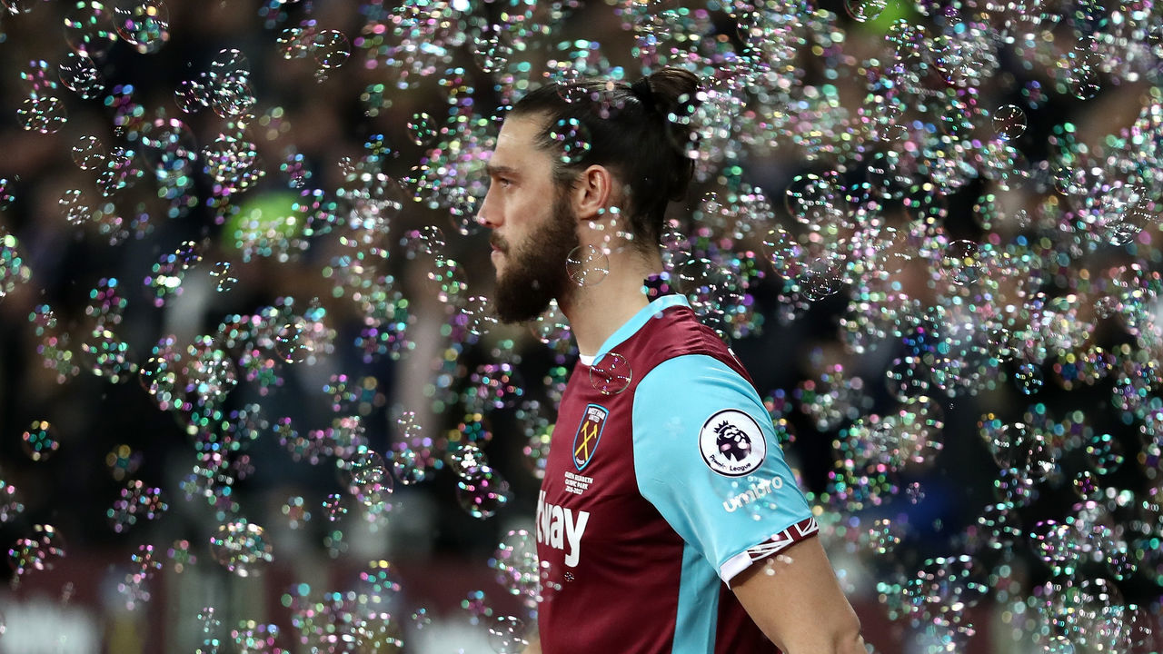 STRATFORD, ENGLAND - MARCH 06: Andy Carroll of West Ham United walks out onto the pitch during the Premier League match between West Ham United and Chelsea at London Stadium on March 6, 2017 in Stratford, England.