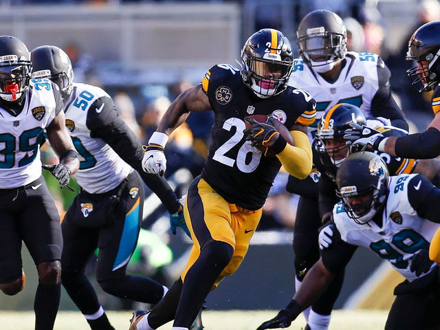 PITTSBURGH, PA - JANUARY 14: Le'Veon Bell #26 of the Pittsburgh Steelers runs with the ball against the Jacksonville Jaguars during the first half of the AFC Divisional Playoff game at Heinz Field on January 14, 2018 in Pittsburgh, Pennsylvania.
