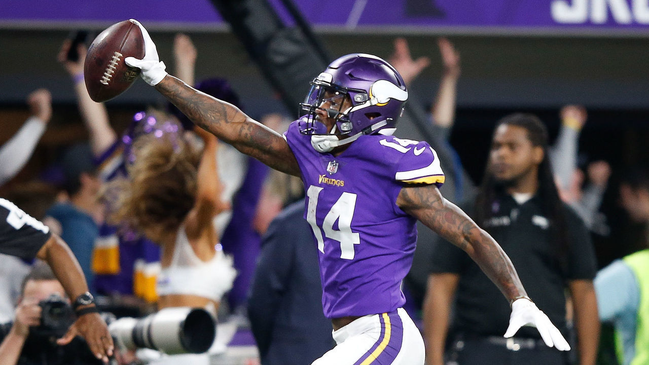 MINNEAPOLIS, MN - JANUARY 14: Stefon Diggs #14 of the Minnesota Vikings scores a touchdown as time expires against the New Orleans Saints during the second half of the NFC Divisional Playoff game at U.S. Bank Stadium on January 14, 2018 in Minneapolis, Minnesota.