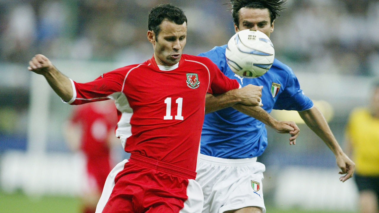 MILAN, ITALY - SEPTEMBER 6: Ryan Giggs of Wales battles with Christian Panucci of Italy during the Euro 2004 Qualifier Group 9 match between Italy and Wales at the San Siro on September 6, 2003 in Milan, Italy.