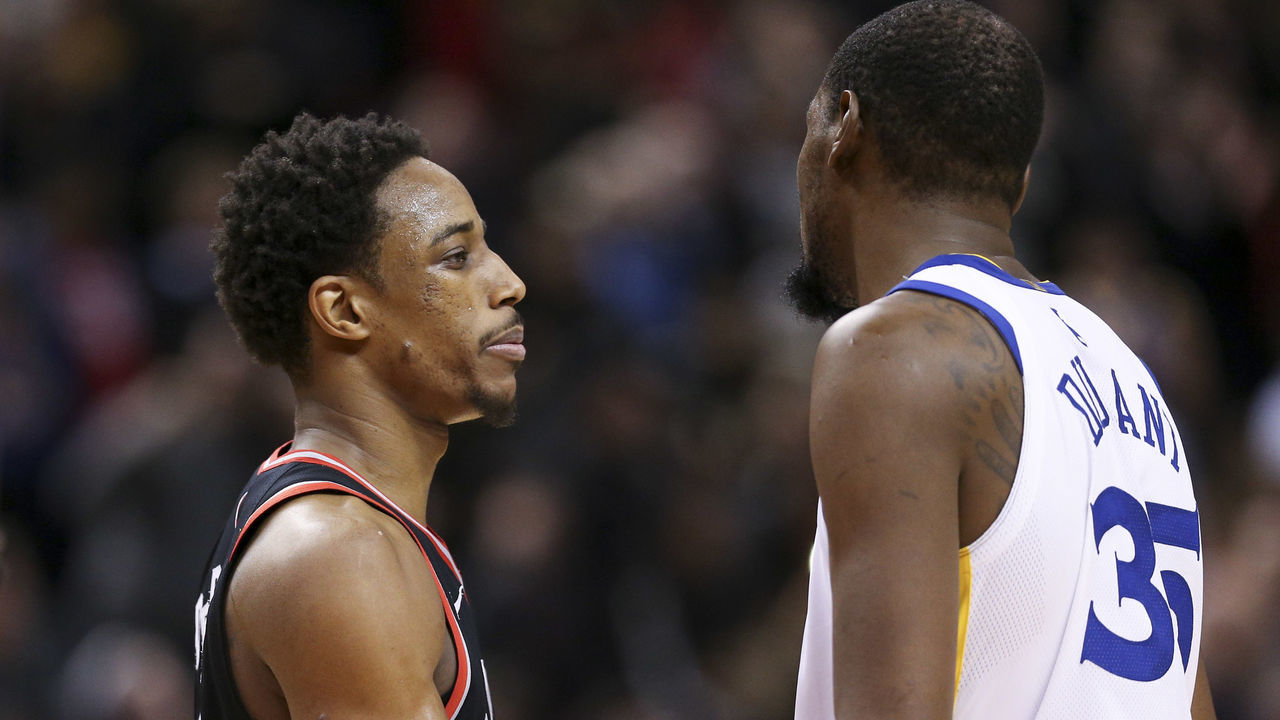TORONTO, ON - JANUARY, 13 At the end of the game, Golden State Warriors forward Kevin Durant (35) and Toronto Raptors guard DeMar DeRozan (10) share a hug. The Toronto Raptors lost to the Golden State Warriors 125-127 in NBA basketball action at the Air Canada Centre in Toronto. January, 13 2018 (Richard Lautens/Toronto Star via Getty Images)