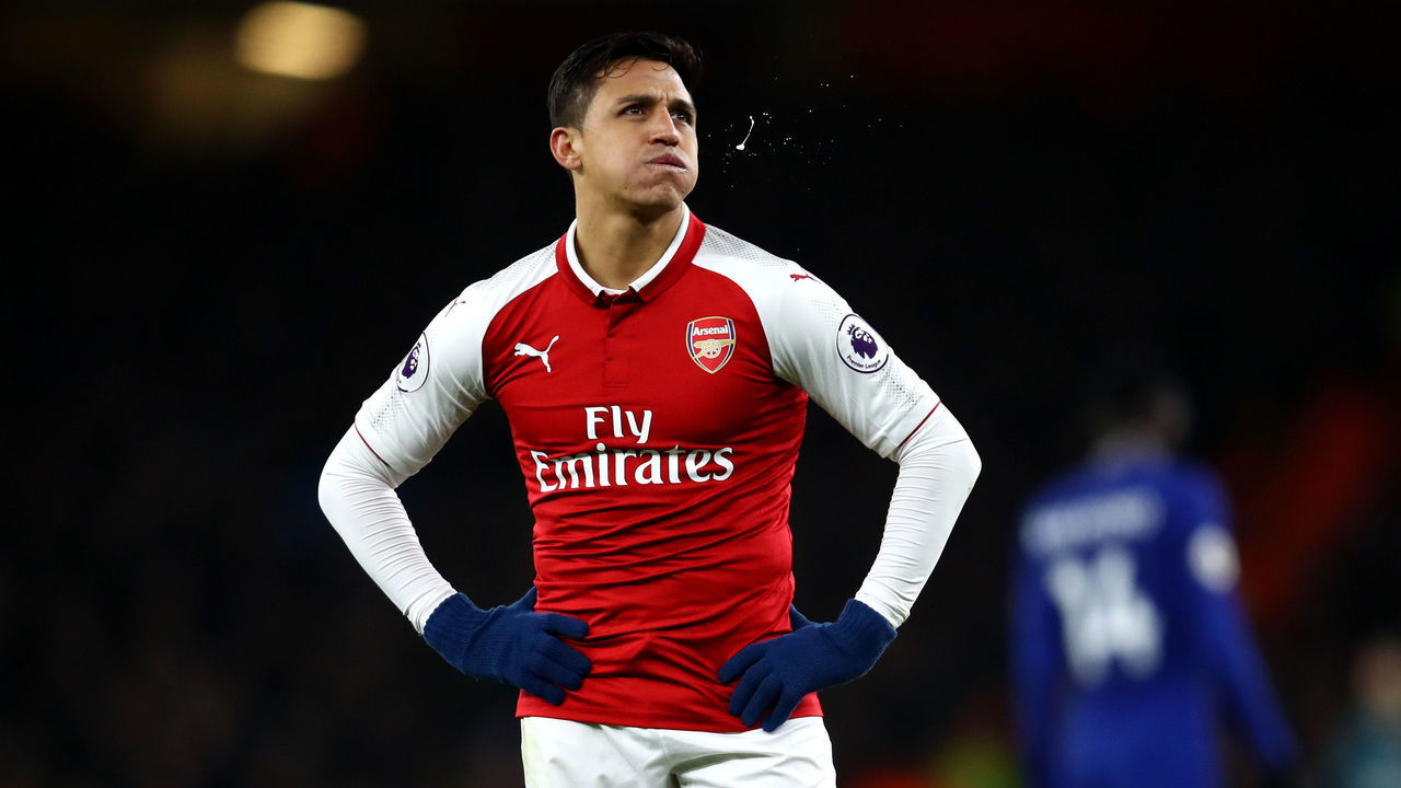 LONDON, ENGLAND - JANUARY 03: Alexis Sanchez of Arsenal spits during the Premier League match between Arsenal and Chelsea at Emirates Stadium on January 3, 2018 in London, England.