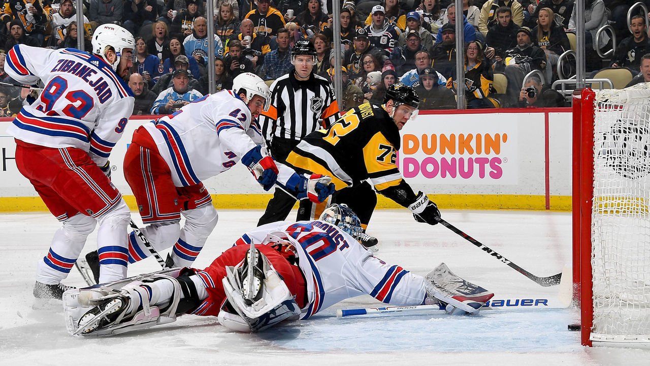 PITTSBURGH, PA - JANUARY 14: Patric Hornqvist #72 of the Pittsburgh Penguins scores past Henrik Lundqvist #30 of the New York Rangers in the first period at PPG Paints Arena on January 14, 2018 in Pittsburgh, Pennsylvania.
