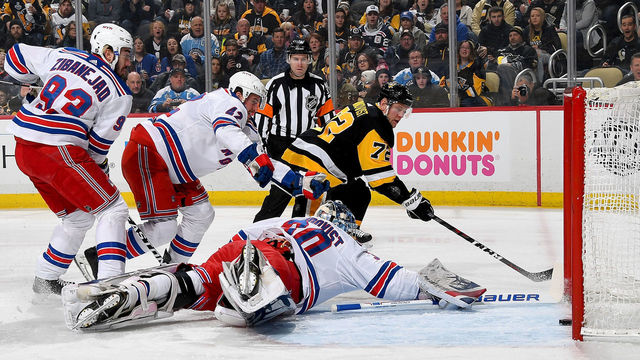 PITTSBURGH, PA - JANUARY 14: Patric Hornqvist #72 of the Pittsburgh Penguins scores past Henrik Lundqvist #30 of the New York Rangers in the first period at PPG Paints Arena on January 14, 2018 in Pittsburgh, Pennsylvania.