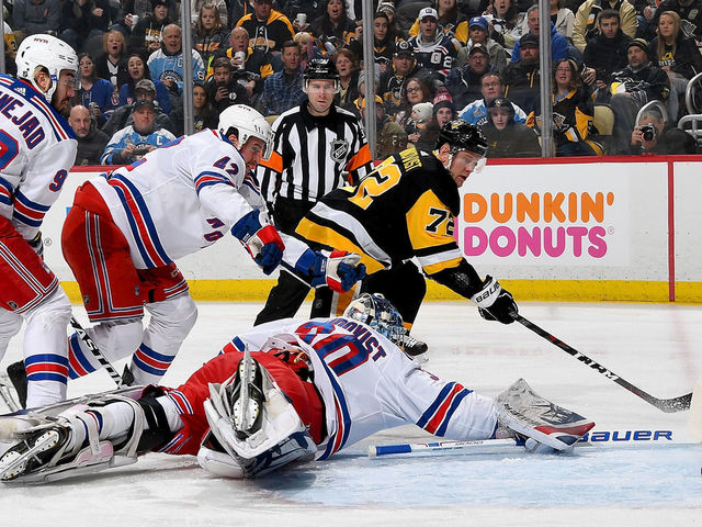 PITTSBURGH, PA - JANUARY 14: Patric Hornqvist #72 of the Pittsburgh Penguins scores past Henrik Lundqvist #30 of the New York Rangers in the first period at PPG Paints Arena on January 14, 2018 in Pittsburgh, Pennsylvania.