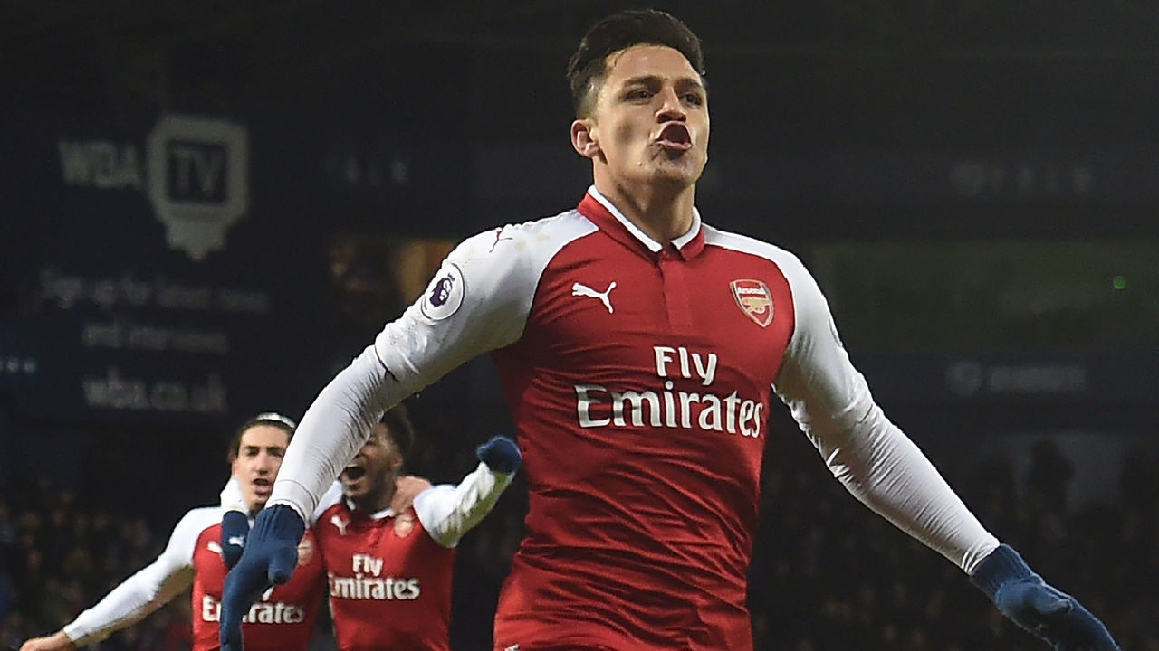 Arsenal's Chilean striker Alexis Sanchez celebrates after scoring the opening goal with a deflected free kick during the English Premier League football match between West Bromwich Albion and Arsenal at The Hawthorns stadium in West Bromwich, central England, on December 31, 2017. / AFP PHOTO / PAUL ELLIS /