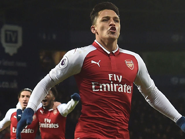 Arsenal's Chilean striker Alexis Sanchez celebrates after scoring the opening goal with a deflected free kick during the English Premier League football match between West Bromwich Albion and Arsenal at The Hawthorns stadium in West Bromwich, central England, on December 31, 2017. / AFP PHOTO / PAUL ELLIS /