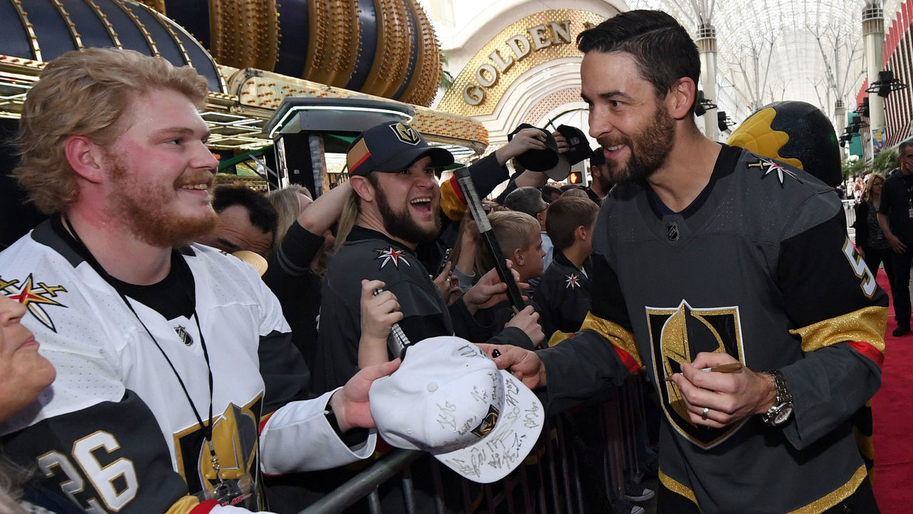 LAS VEGAS, NV - JANUARY 14: Deryk Engelland #5 of the Vegas Golden Knights signs autographs for fans as he walks a red carpet at the Vegas Golden Knights Fan Fest at the Fremont Street Experience on January 14, 2018 in Las Vegas, Nevada.