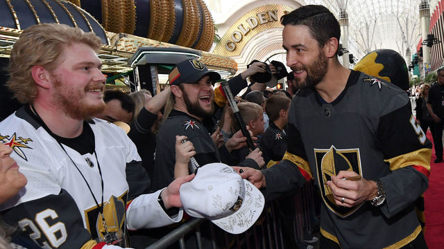 LAS VEGAS, NV - JANUARY 14: Deryk Engelland #5 of the Vegas Golden Knights signs autographs for fans as he walks a red carpet at the Vegas Golden Knights Fan Fest at the Fremont Street Experience on January 14, 2018 in Las Vegas, Nevada.