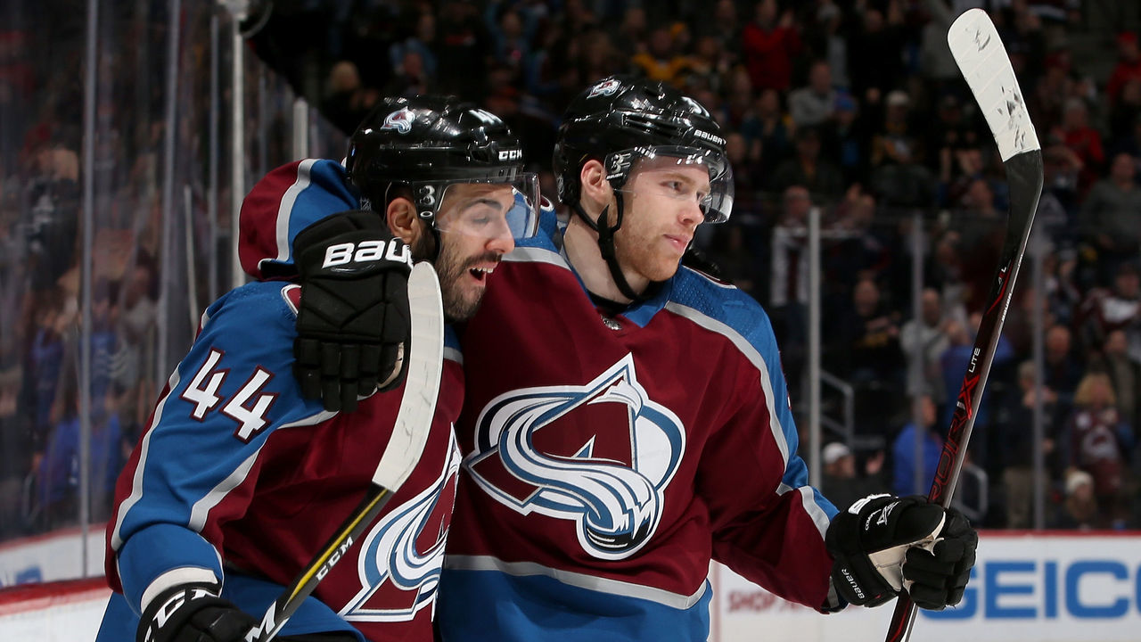 DENVER, CO - DECEMBER 18: Mark Barberio #44 and J.T. Compher #37 of the Colorado Avalanche celebrates Compher's goal against the Pittsburgh Penguins at the Pepsi Center on December 18, 2017 in Denver, Colorado.