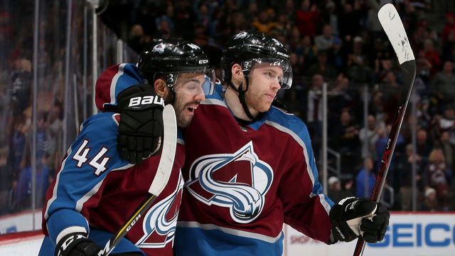 DENVER, CO - DECEMBER 18: Mark Barberio #44 and J.T. Compher #37 of the Colorado Avalanche celebrates Compher's goal against the Pittsburgh Penguins at the Pepsi Center on December 18, 2017 in Denver, Colorado.