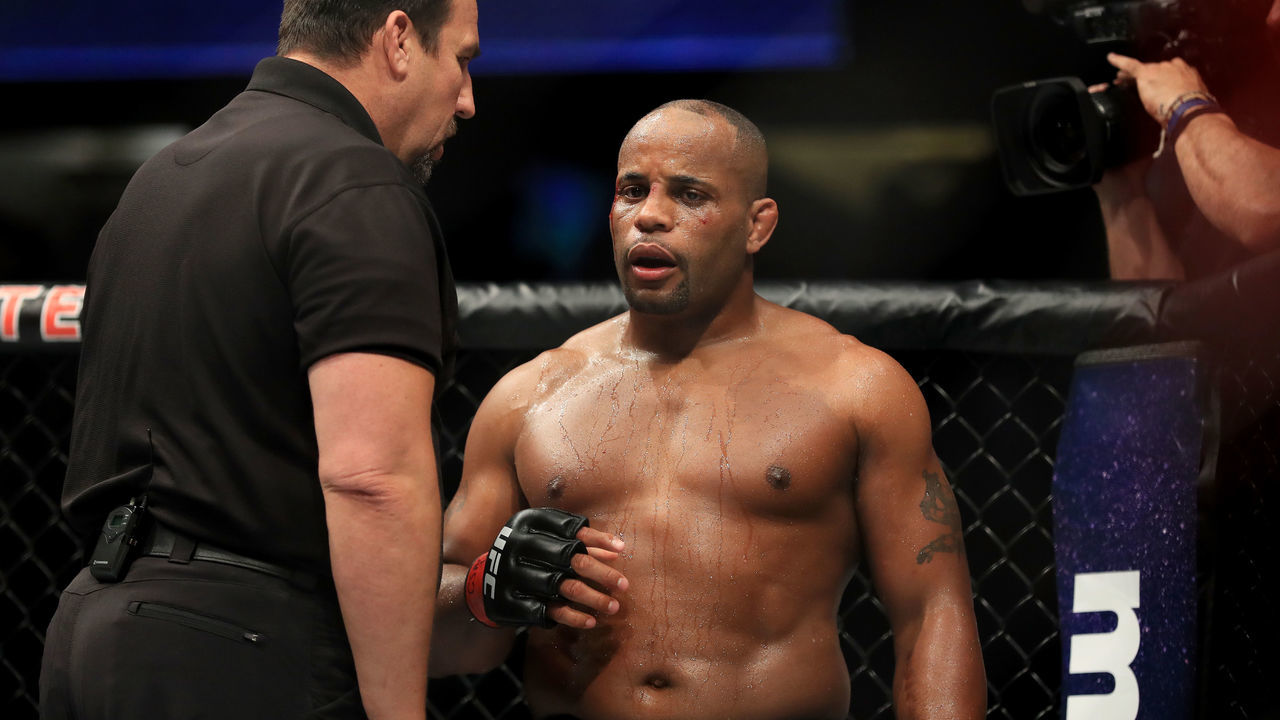 ANAHEIM, CA - JULY 29: Daniel Cormier is checked by referee John McCarthy after receiving an accidental headbutt from opponent Jon Jones (not pictured during the UFC 214 event at Honda Center on July 29, 2017 in Anaheim, California.