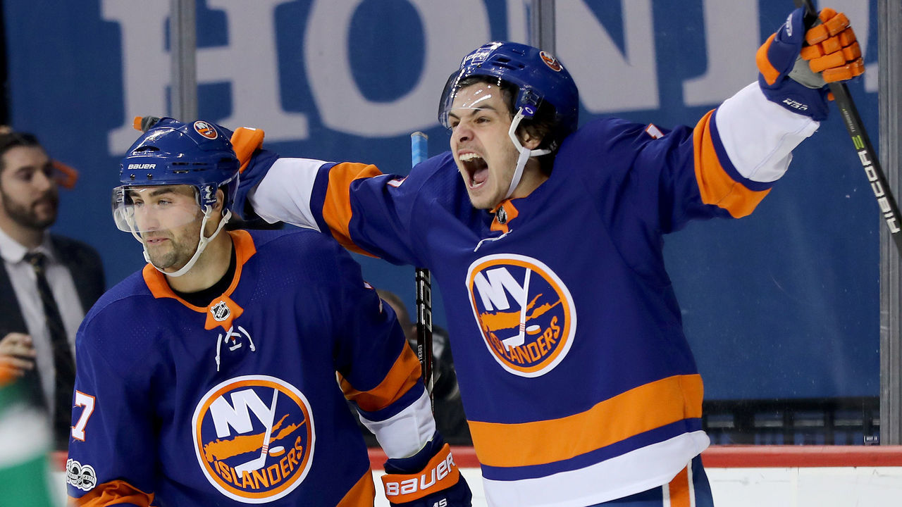 NEW YORK, NEW YORK - DECEMBER 16: Jordan Eberle #7 of the New York Islanders is congratulated by teammae Mathew Barzal #13 after Eberle scored the game winning goal in overtime against the Los Angeles Kings on December 16, 2017 at Barclays Center in the Brooklyn borough of New York City.The New York Islanders defeated the Los Angeles Kings 4-3 in overtime.