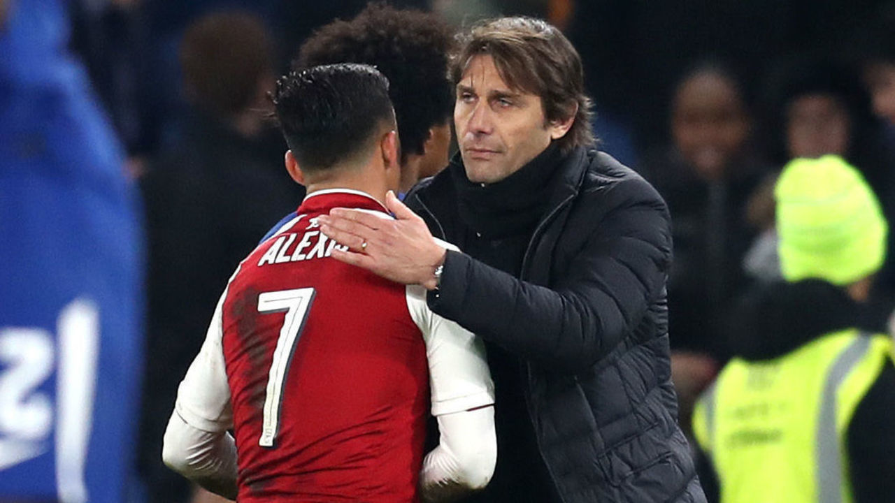 LONDON, ENGLAND - JANUARY 10: Alexis Sanchez of Arsenal speaks with Antonio Conte, Manager of Chelsea during the Carabao Cup Semi-Final First Leg match between Chelsea and Arsenal at Stamford Bridge on January 10, 2018 in London, England.