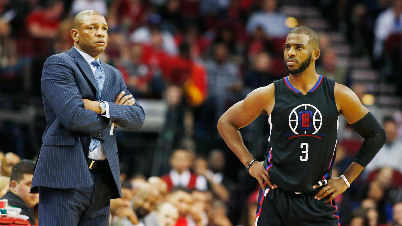 HOUSTON, TX - DECEMBER 19: Head coach Doc Rivers of the Los Angeles Clippers and Chris Paul #3 wait near the bench during their game against the Houston Rockets at Toyota Center on December 19, 2015 in Houston, Texas.