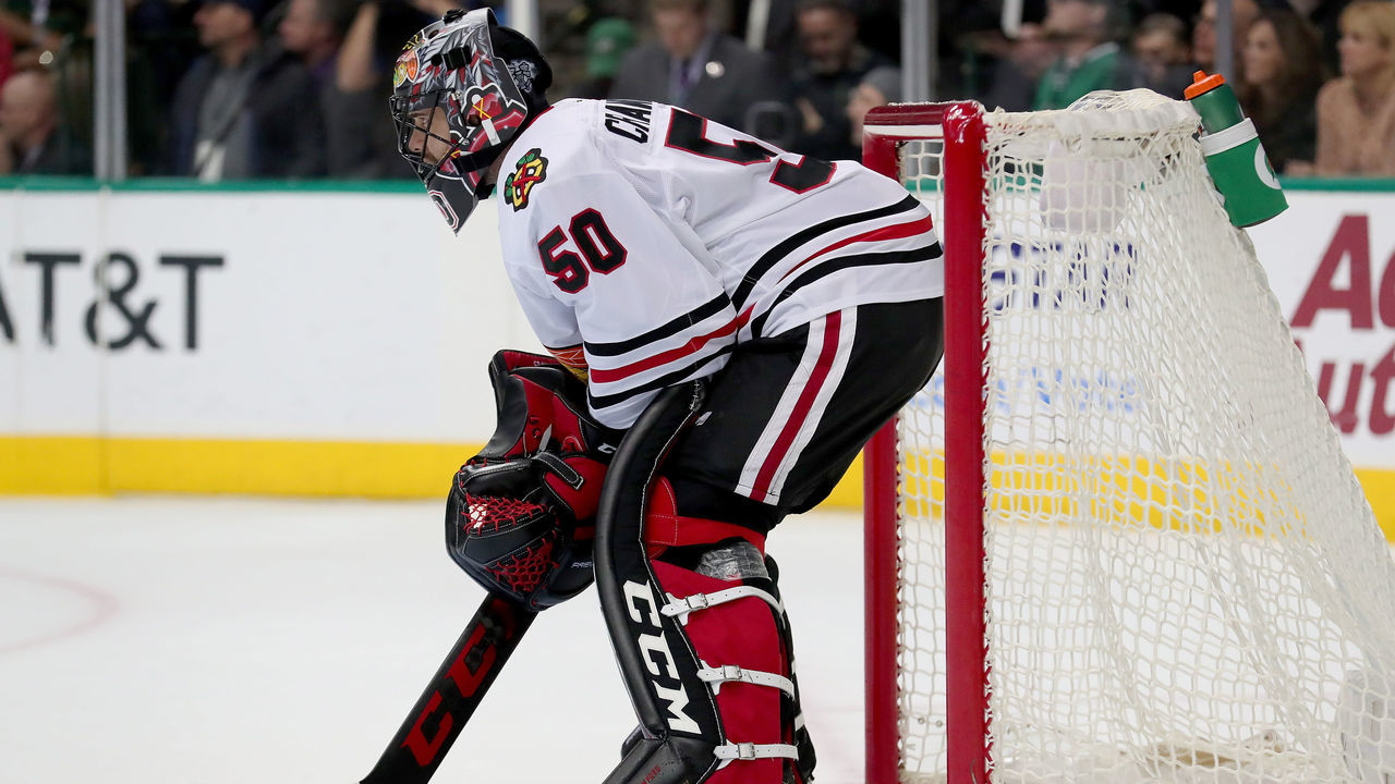 DALLAS, TX - DECEMBER 21: Corey Crawford #50 of the Chicago Blackhawks reacts after giving up a goal against the Dallas Stars in the first period at American Airlines Center on December 21, 2017 in Dallas, Texas.